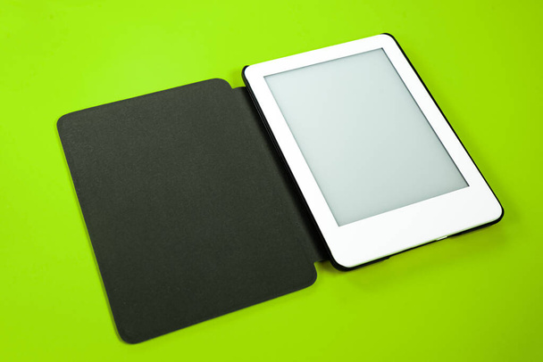 Ebook reader over yellow background - Photo, image