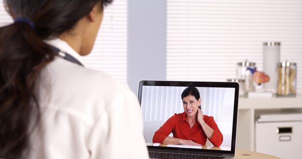 Elderly patient video chatting with doctor - Foto, imagen