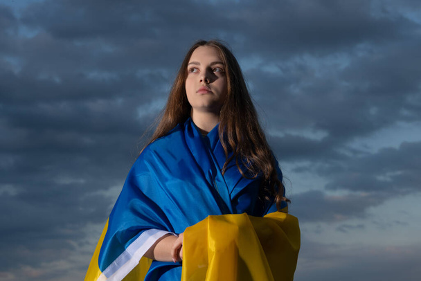 patriotic teen ukrainian girl with national flag of ukraine - Foto, Bild
