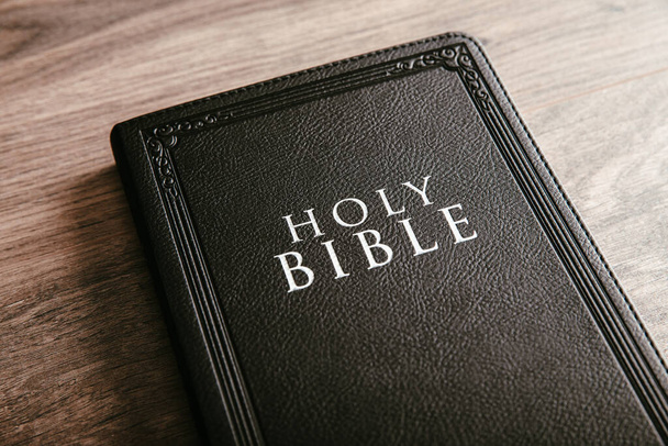 Holy Bible on the wooden table backgroun - Φωτογραφία, εικόνα