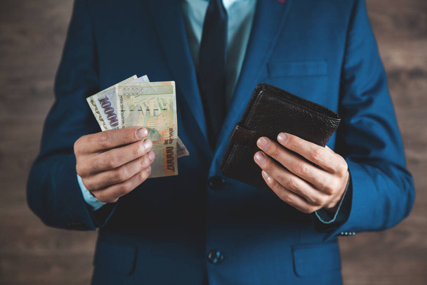 man hand  holding money with wallet - Φωτογραφία, εικόνα