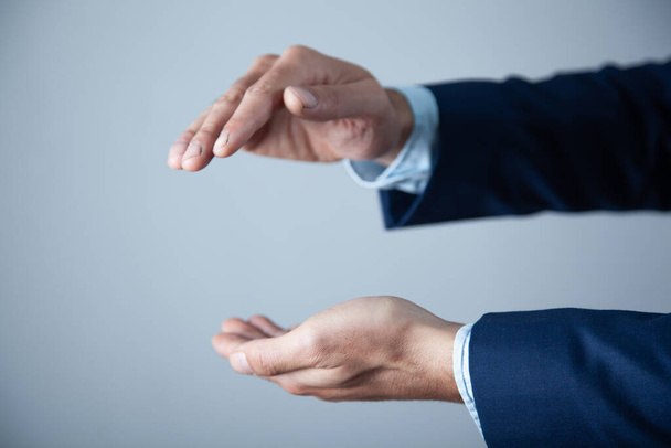business man empty hand on gray background - Фото, изображение