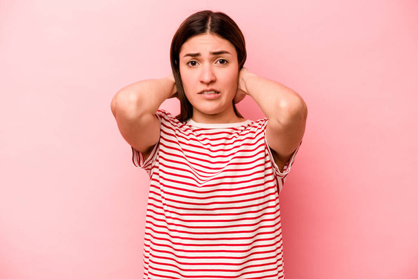 Young caucasian woman isolated on pink background screaming with rage. - Photo, Image