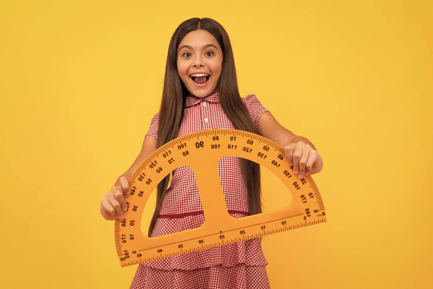 education for child. mathematics. amazed teen girl hold protractor ruler. back to school. - Foto, immagini