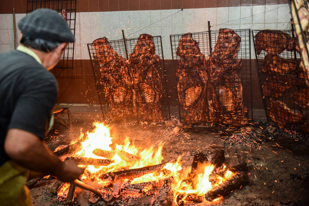 Gaucho roast barbecue, sausage and cow ribs, traditional argentine cuisine, Patagonia, Argentina. - Photo, Image