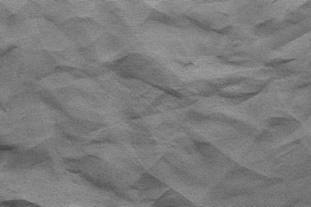 зім'ята сітка синтетична тканина сірого кольору
 - Фото, зображення