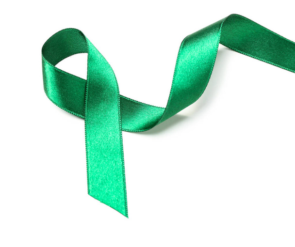 Green ribbon on white background. Liver cancer concept - Photo, Image