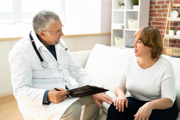 Doctor Talking With Elderly  Patient. Elder Healthcare - Fotografie, Obrázek