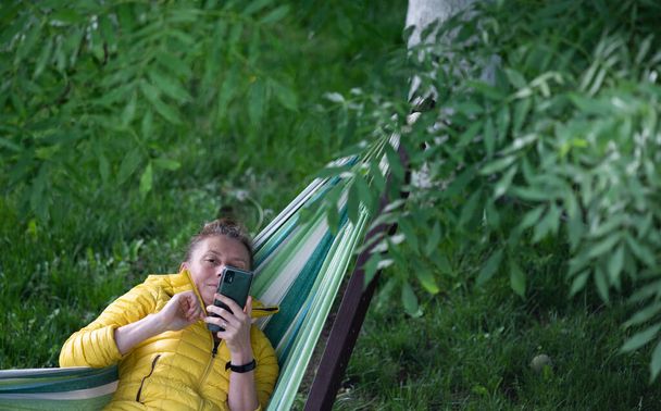top view of woman relaxing in hammock - Photo, Image