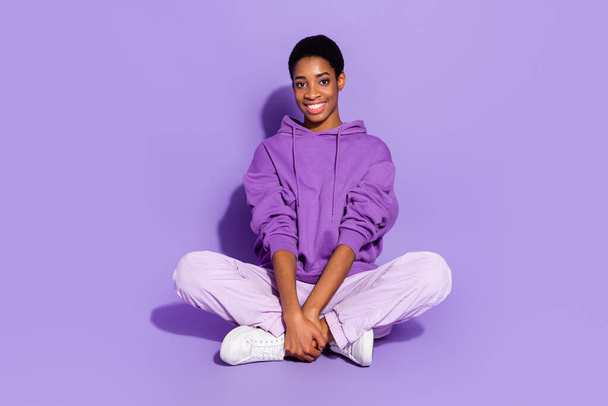 Photo of young pretty nonbinary person relaxing during weekends wear cool hoodie isolated on violet color background - Fotó, kép