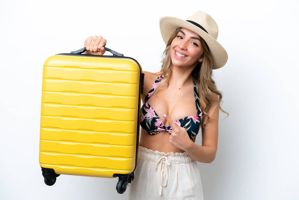 Girl in swimsuit in summer holidays isolated on white background in vacation with travel suitcase - Photo, Image