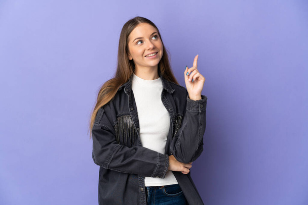 Young Lithuanian woman isolated on purple background pointing up a great idea - Photo, Image