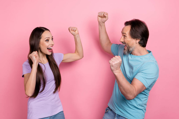 Photo of overjoyed ecstatic wife and husband celebrate their wedding anniversary isolated on pink color background - Photo, image
