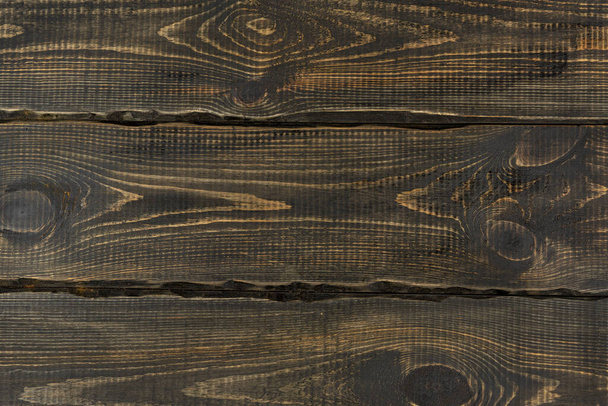 Dekorative Textur aus dunklen Holzdielen. Holzwand. leerer Hintergrund für Designer - Foto, Bild