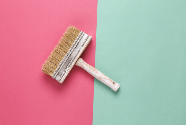 Paint brush on pink blue background. Minimalism - Photo, Image