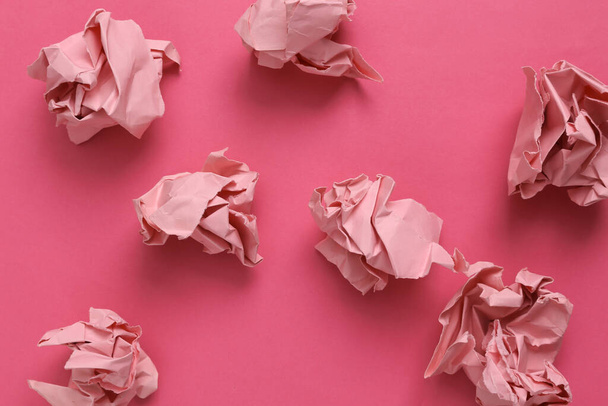 Pink crumpled paper balls on pink background - Photo, image
