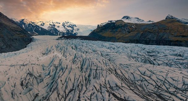 Beautiful glaciers flow through the mountains in Iceland. Aerial view and top view. - Zdjęcie, obraz