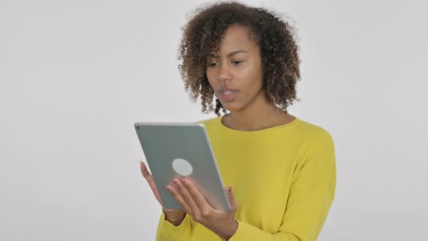 African Woman Celebrating Success on Tablet on White Background  - Video, Çekim