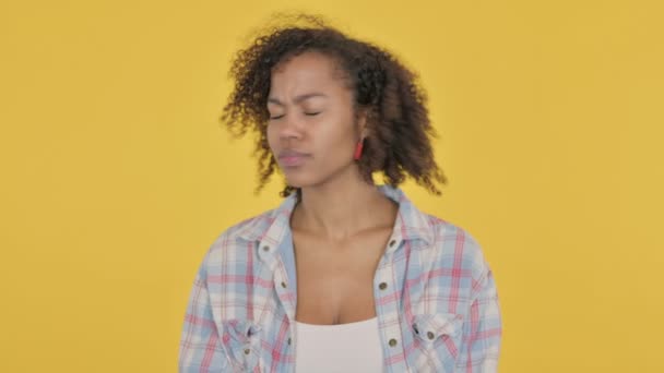 African Woman showing No Sign by Finger on Yellow Background  - Materiaali, video