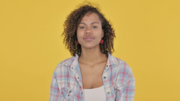 African Woman Pointing at Camera, Inviting on Yellow Background  - Video