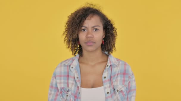 African Woman Showing No Sign by Arm Gesture on Yellow Background  - Felvétel, videó