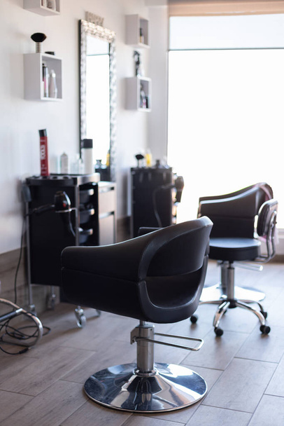 Interior with chairs in new beauty salon. Working place of hairdresser. - Fotoğraf, Görsel