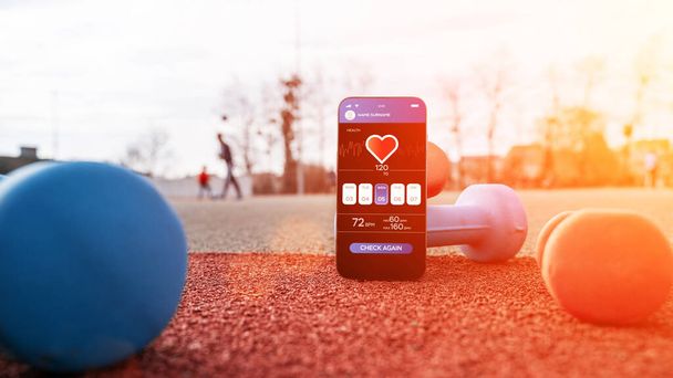 健康アプリ。フィットネス健康やダンベルの背景にスポーツジムのモバイルアプリケーションとスマートフォンの画面。ホームオンラインワークアウト - 写真・画像