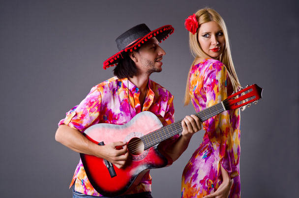 Spanish pair playing guitar and dancing - Photo, Image