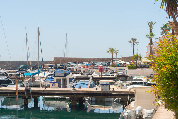 LA HERRADURA, SPAIN - 17 MAY 2022 The Marina del Este port, in a very beautiful natural and privileged position between the mountains and the sea, serves 227 berths with a maximum length of 35 meters - Fotografie, Obrázek