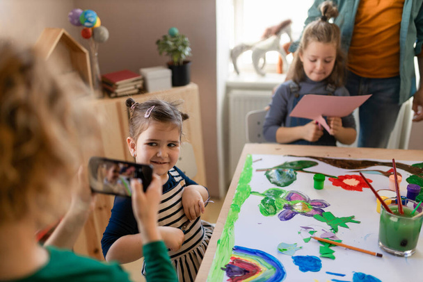 A group of little kids working on project during creative art and craft class at school. - Фото, зображення
