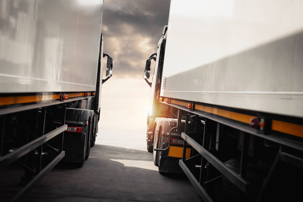 Semi TrailerTrucks Parked with Sunset Sky. Shipping Container Trucks. Truck Wheels Tires. Engine Diesel. Lorry Tractor. Industry Freight Trucks Logistics Cargo Transport. - Photo, Image