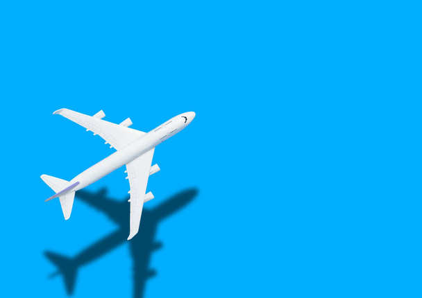 Airplane model for online ticket and tourism concept, airplane blue background - Photo, Image