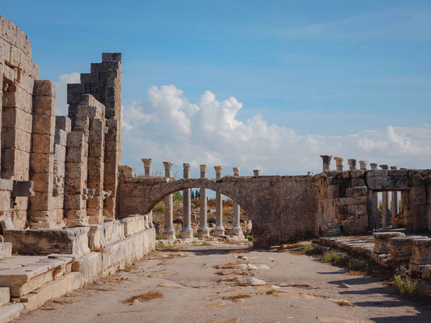 Agora columns with great sky viewin Perge or Perga ancient Greek city - once capital of Pamphylia in Antalya Turkey on warm October afternoon. - Photo, Image