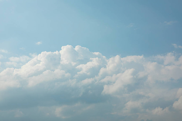 Background from white and fluffy clouds in the blue sky - Photo, image
