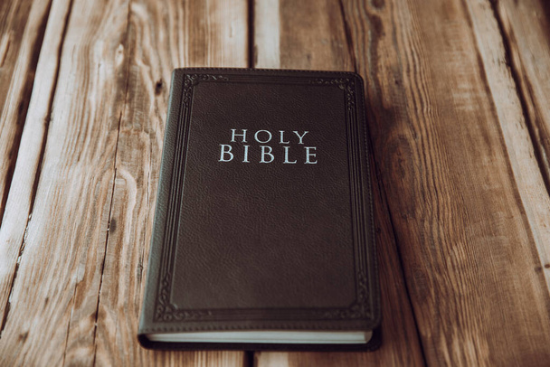 Holy Bible on the wooden table backgroun - Foto, imagen