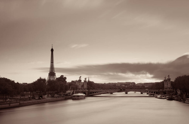 Paris River Seine with Eiffel tower and Alexandre III bridge at sunset - Photo, Image