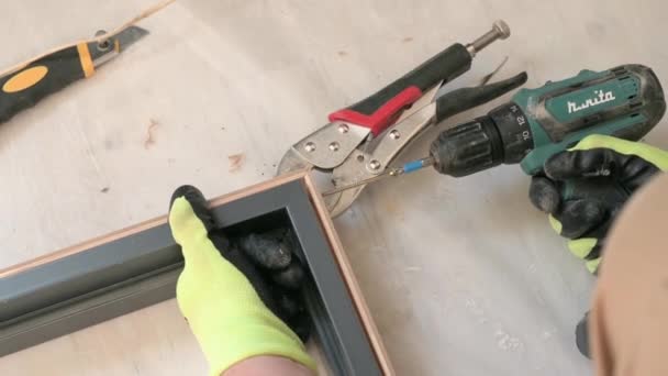 Drilling a hole in the door frame for further connection of the doorway, tools for installing the door, drilling close up. - Footage, Video