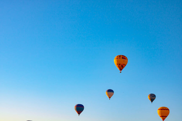 Hot air balloons on the sky. Ballooning activity or Hot air ballon festival background photo. - Foto, imagen