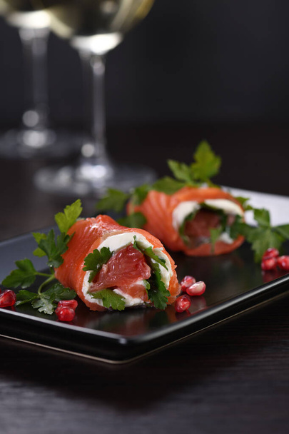 Salmon strip with cream cheese and grapefruit, rolled up - Photo, Image