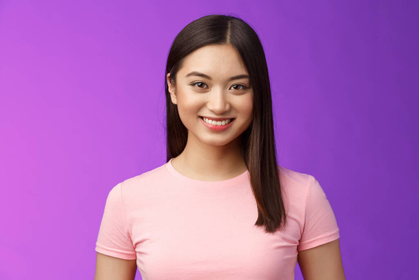 Close-up motivated assertive good-looking asian woman smiling toothy white perfect grin, stand casually have pleasant conversation, talking upbeat, have exciting positive mood purple background. - Φωτογραφία, εικόνα