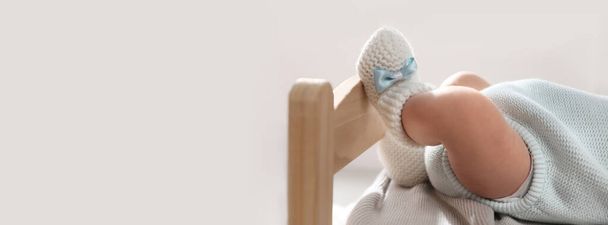 Adorable newborn baby on small wooden bed indoors, closeup view with space for text. Banner design - Fotografie, Obrázek