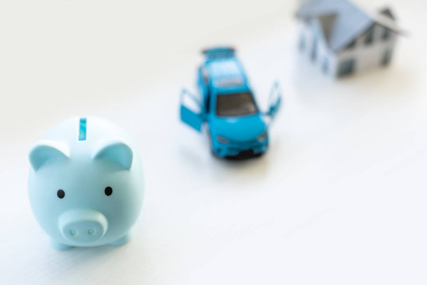 pig piggy bank, toy car, house. - Φωτογραφία, εικόνα