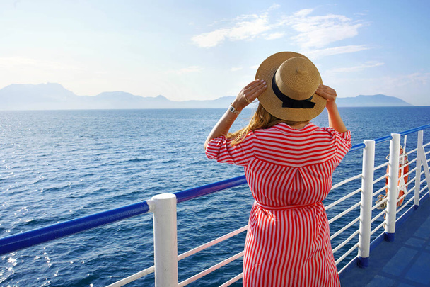 Cruise ship vacation holiday. Back view of stylish girl traveling on cruise liner. Copy space. - Фото, зображення