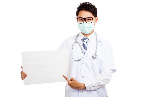 Asian male doctor wear mask point to  blank banner - Photo, Image