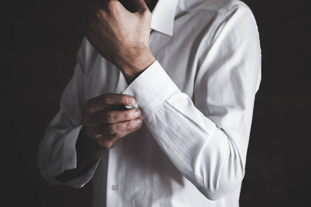 man hand shirt on the dark background - Фото, зображення