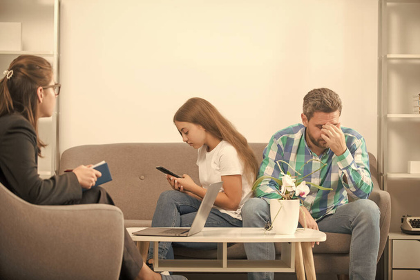 worried father talk to family psychologist about phone addicted child, relationship. - Photo, Image