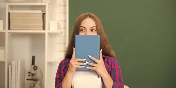 teen girl ready to study. kid do homework with book. teenager student. modern education. high school. schoolgirl with copybook. child hold notebook. back to school. - Photo, Image