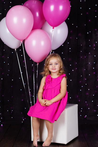 Little girl with pink balloons - 写真・画像