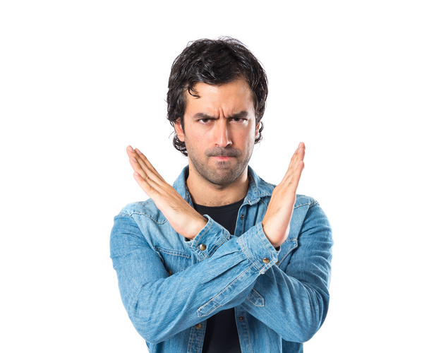 Man doing NO gesture over white background - Photo, Image