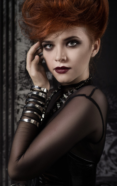 Portrait of redhead girl in black dress - Fotó, kép